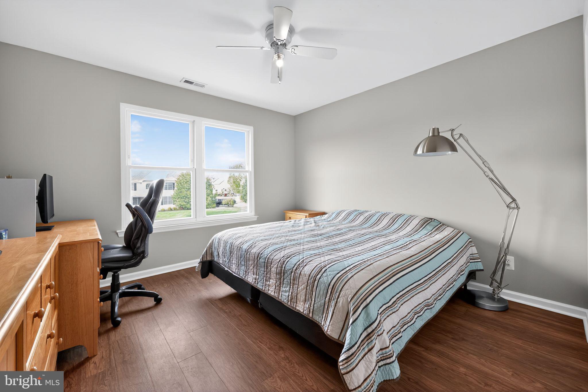 562 Partridge Court Mickleton, NJ 08056 - Photo 22 of 33 a bedroom with a bed a desk and chair