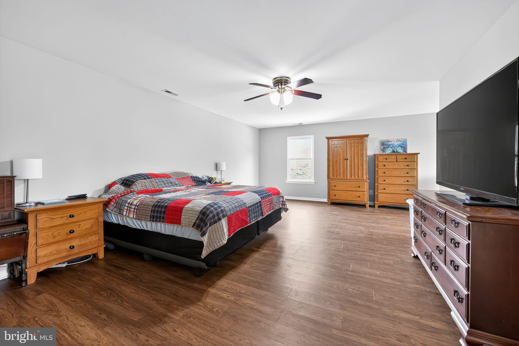 562 Partridge Court Mickleton, NJ 08056 - Photo 23 of 33 a bedroom with a bed and a flat screen tv