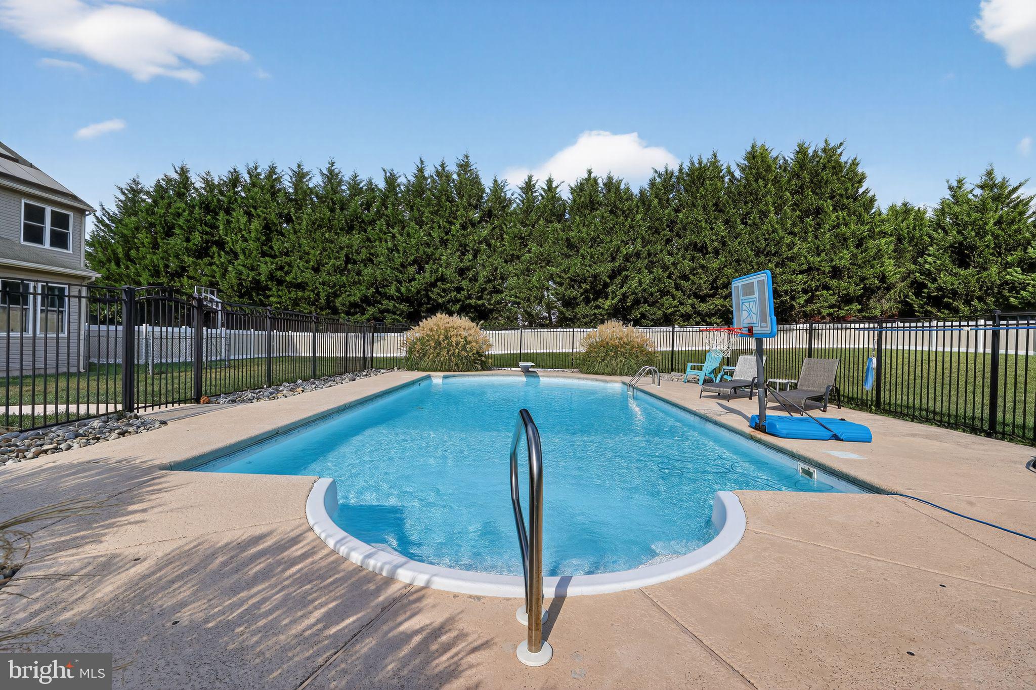 562 Partridge Court Mickleton, NJ 08056 - Photo 30 of 33 a view of a swimming pool with a lounge chairs