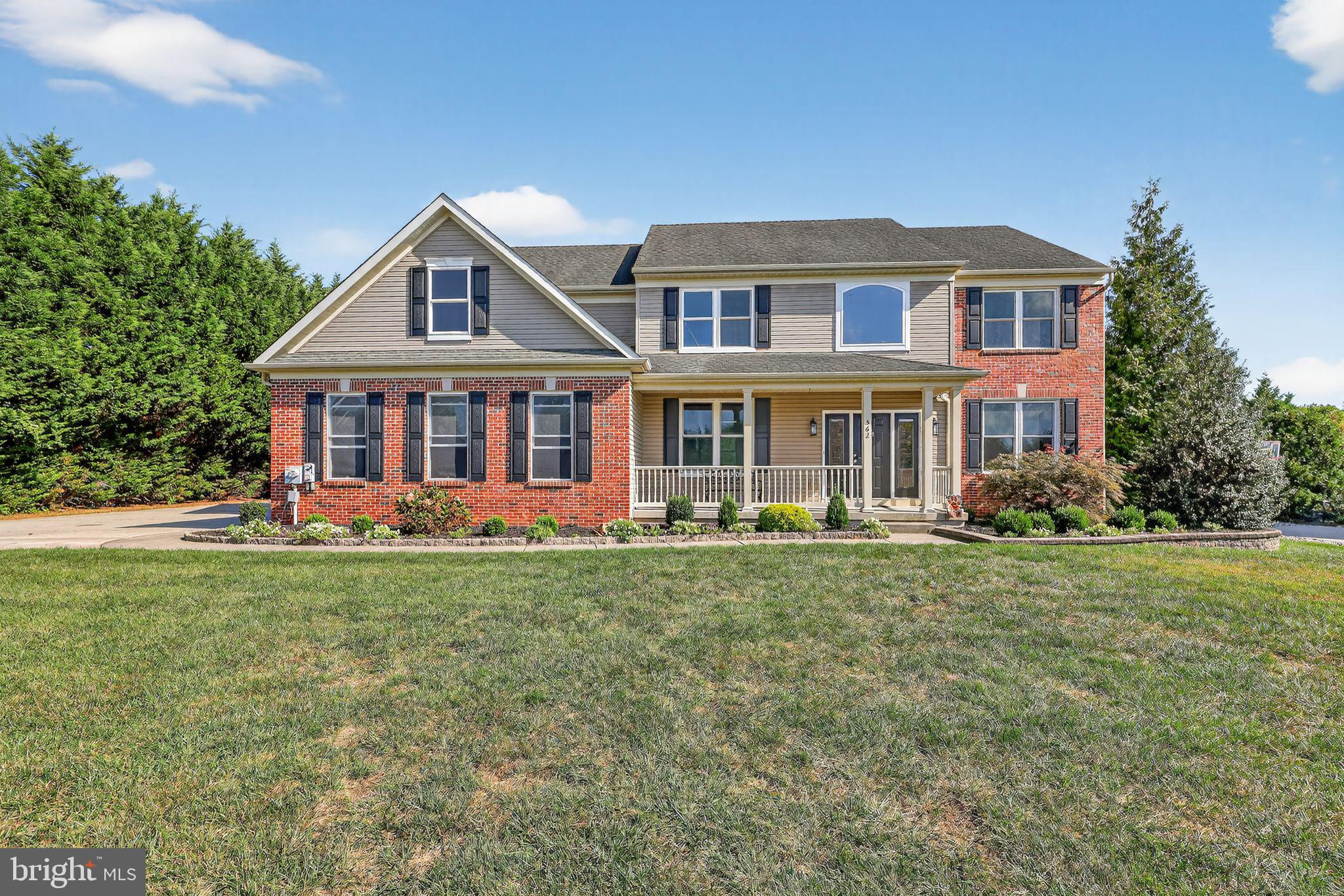 562 Partridge Court Mickleton, NJ 08056 - Photo 3 of 33 a front view of a house with a yard