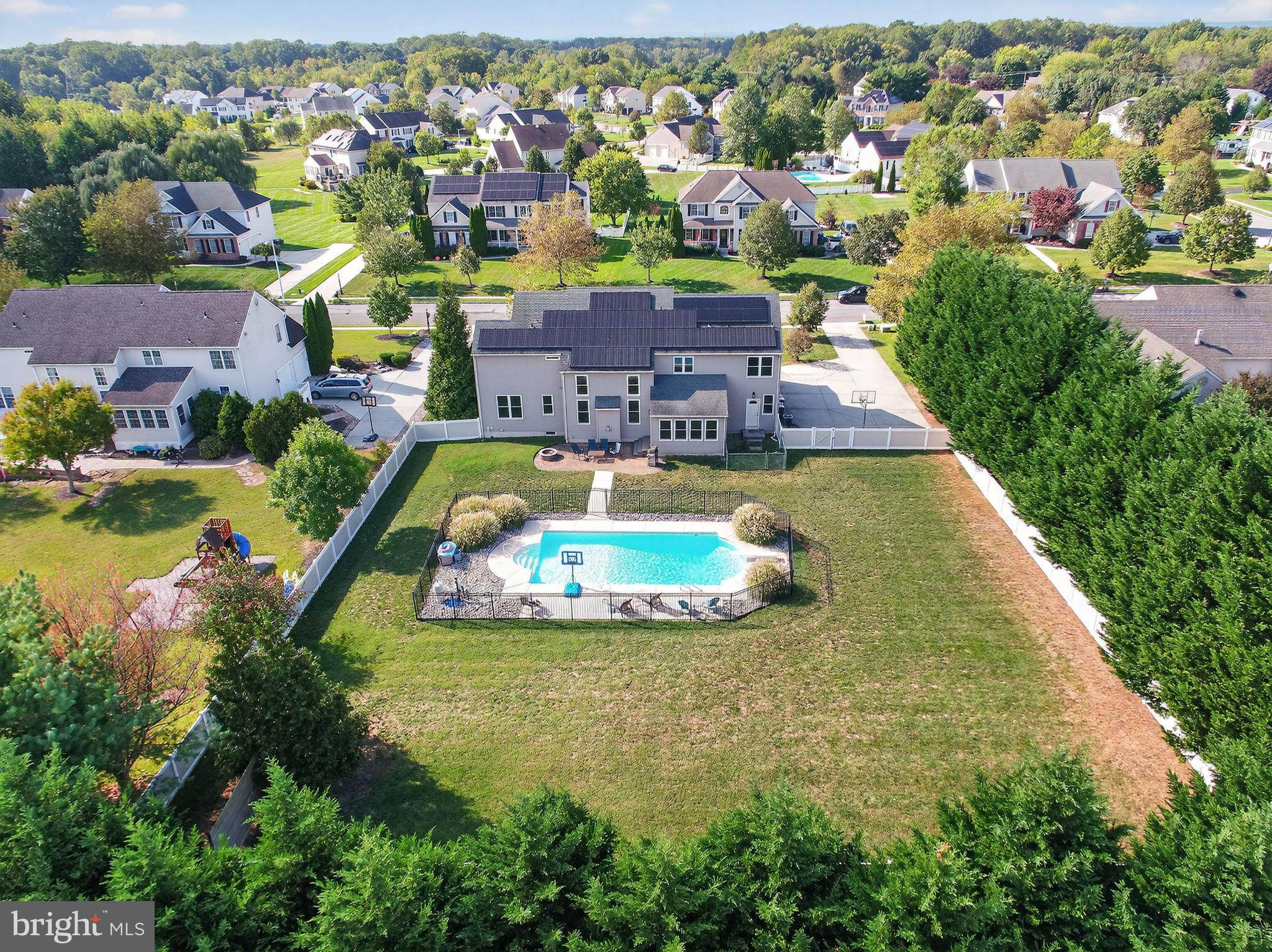 562 Partridge Court Mickleton, NJ 08056 - Photo 32 of 33 an aerial view of a house with swimming pool yard and outdoor seating