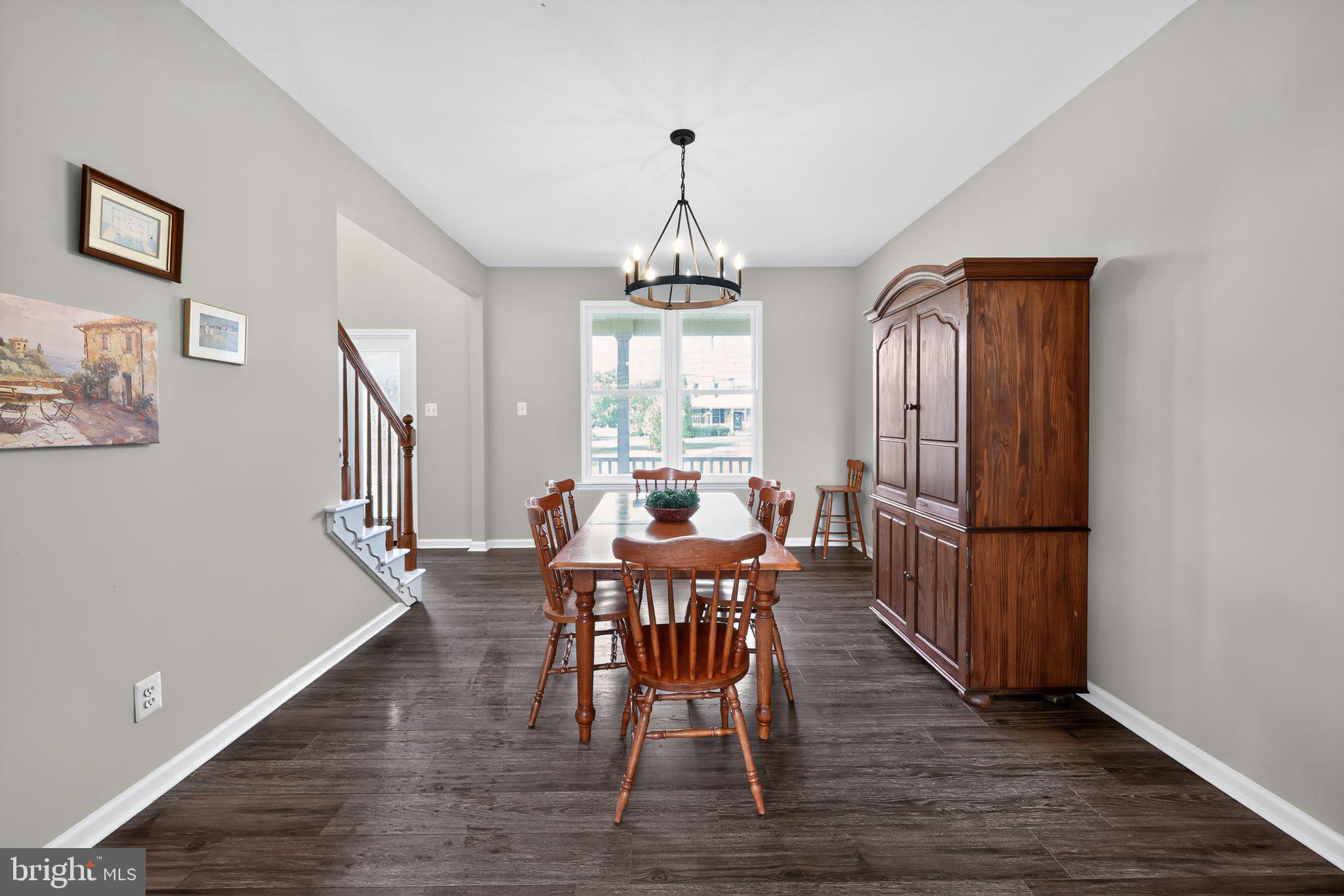 562 Partridge Court Mickleton, NJ 08056 - Photo 7 of 33 a view of a dining room with furniture window and wooden floor