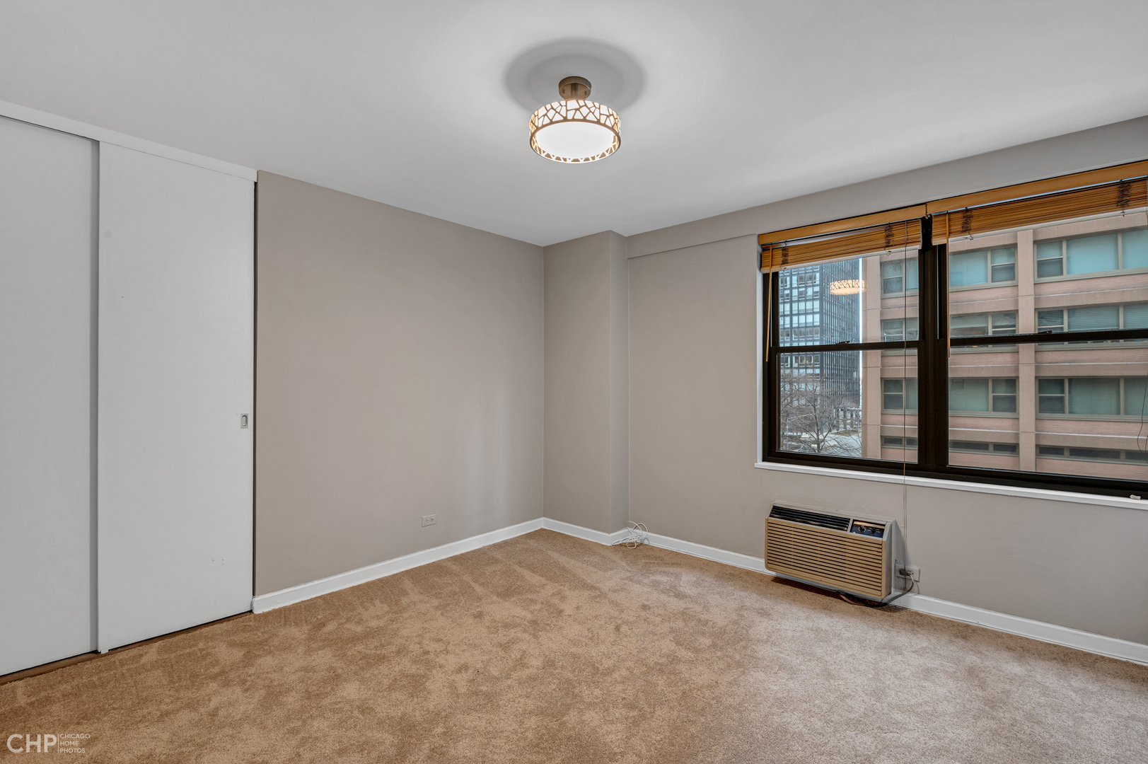 850 North Dewitt Place, Unit 4A Chicago, IL 60611 - Photo 16 of 22 an empty room with windows