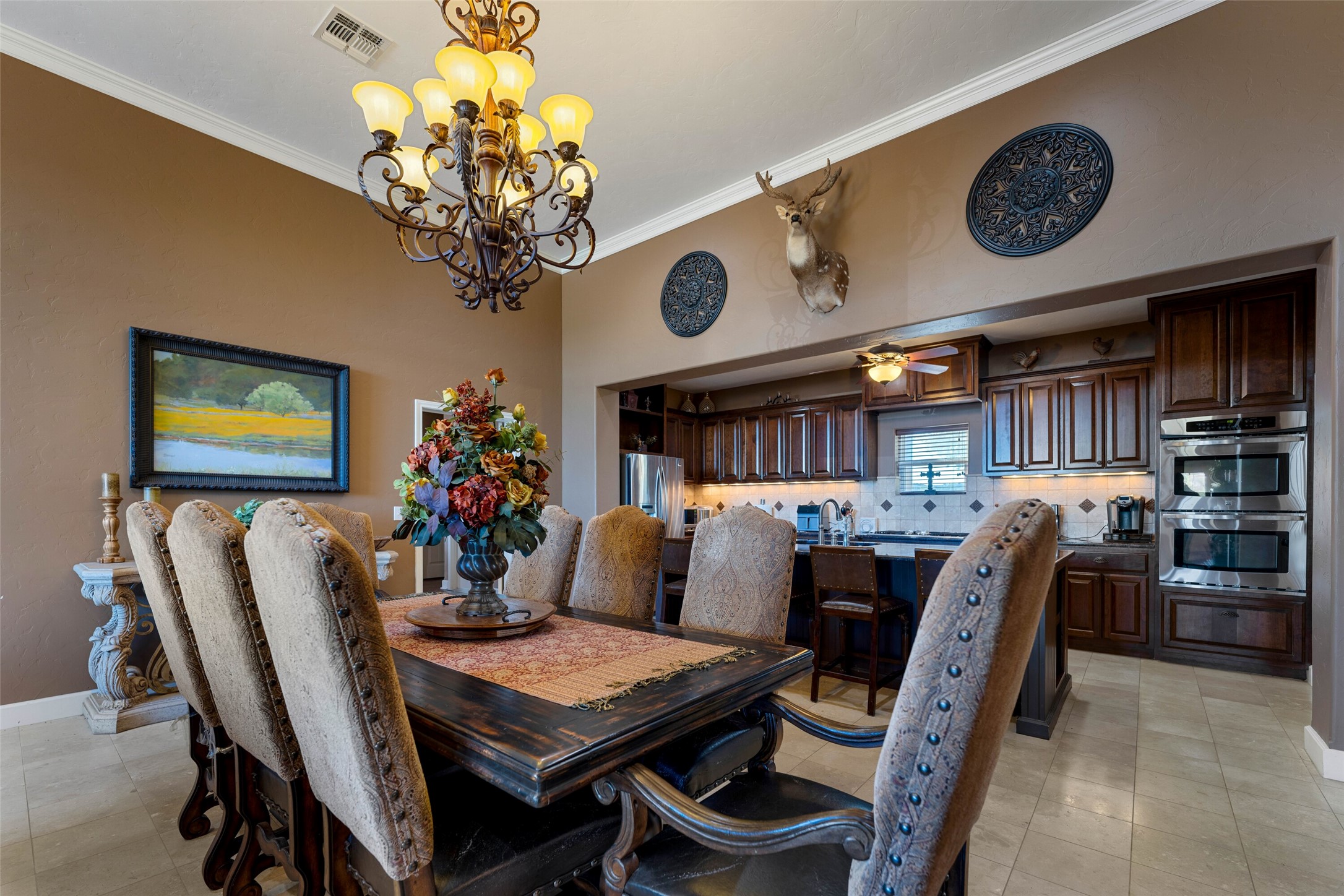 7702 Ranch Road 965 Llano, TX 78643 - Photo 6 of 40 a view of a dining room with furniture and a chandelier