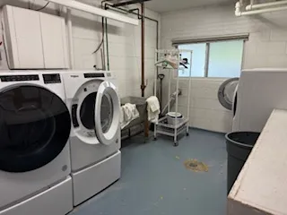 a lobby with furniture and large window