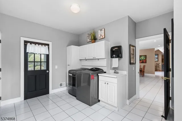 a kitchen with stainless steel appliances granite countertop a stove and a refrigerator