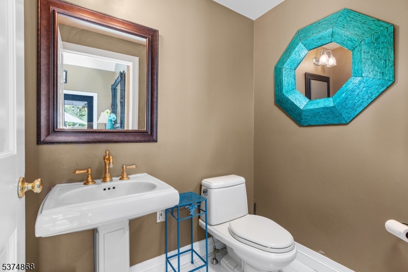 334 West Valley Brook Road Califon, NJ 07830 - Photo 14 of 44 a bathroom with a toilet sink and mirror