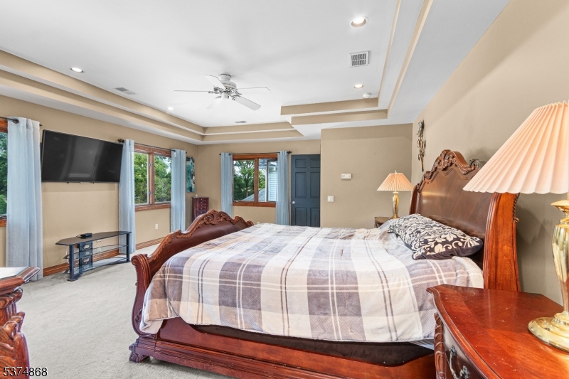 334 West Valley Brook Road Califon, NJ 07830 - Photo 20 of 44 a bedroom with a bed and wooden floor