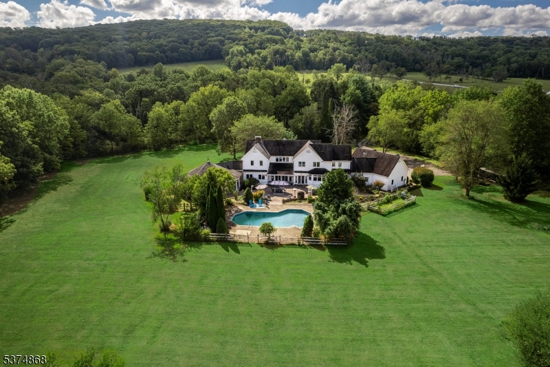 334 West Valley Brook Road Califon, NJ 07830 - Photo 28 of 44 a backyard of a house with a yard and outdoor seating