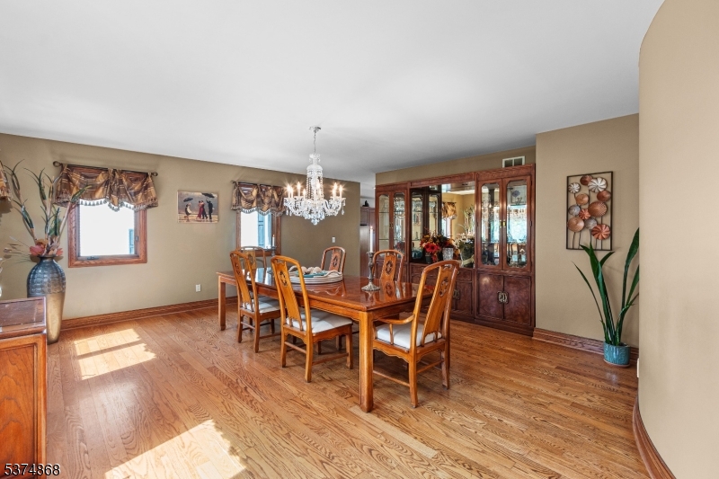 334 West Valley Brook Road Califon, NJ 07830 - Photo 7 of 44 a view of a dining room with furniture and wooden floor