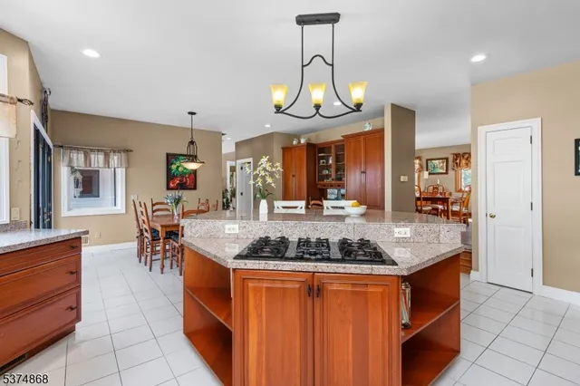a kitchen with stainless steel appliances granite countertop a stove and a sink