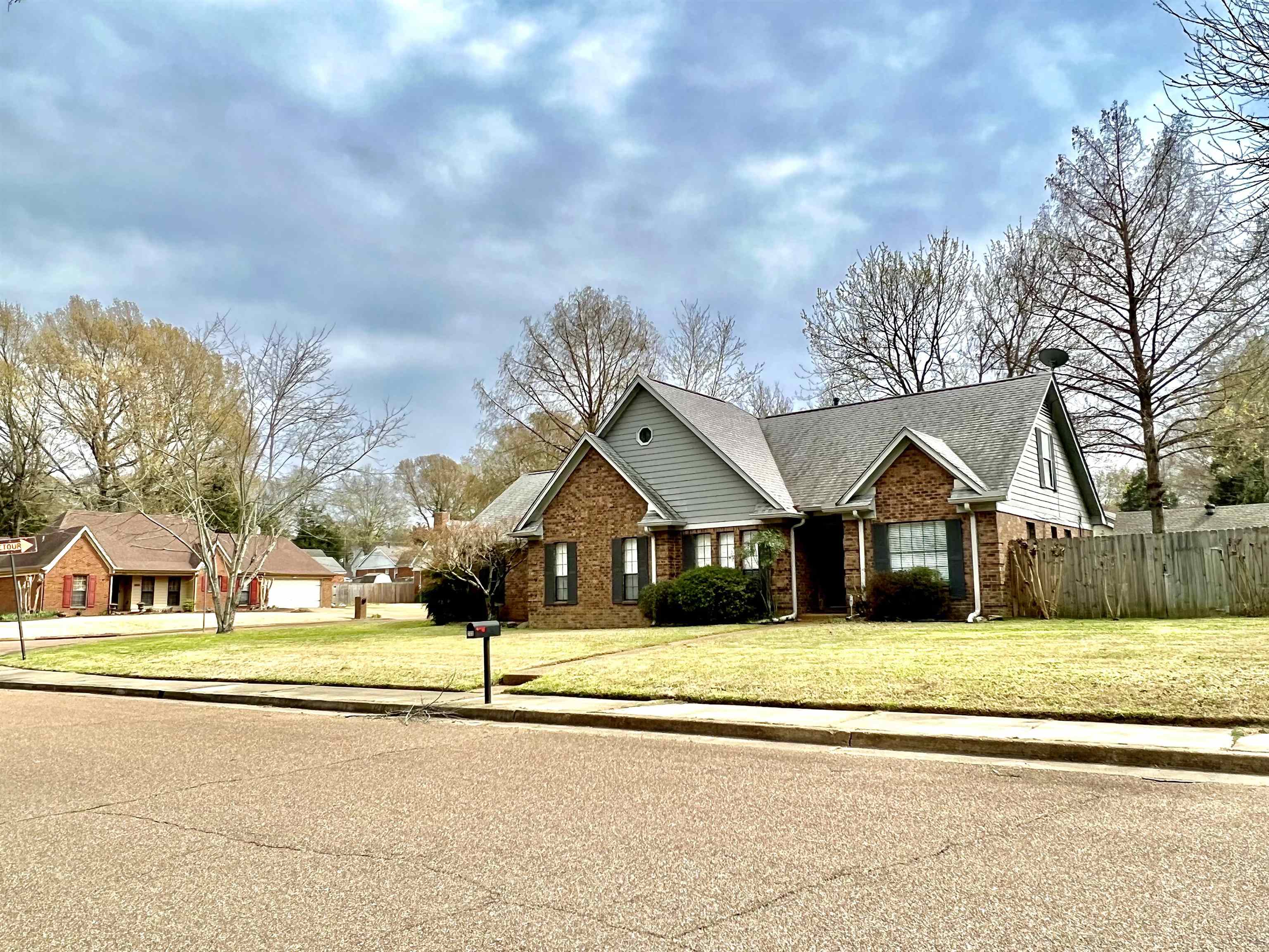 203 Glen Echo Road Collierville, TN 38017 - Photo 2 of 12 a front view of a house with a garden