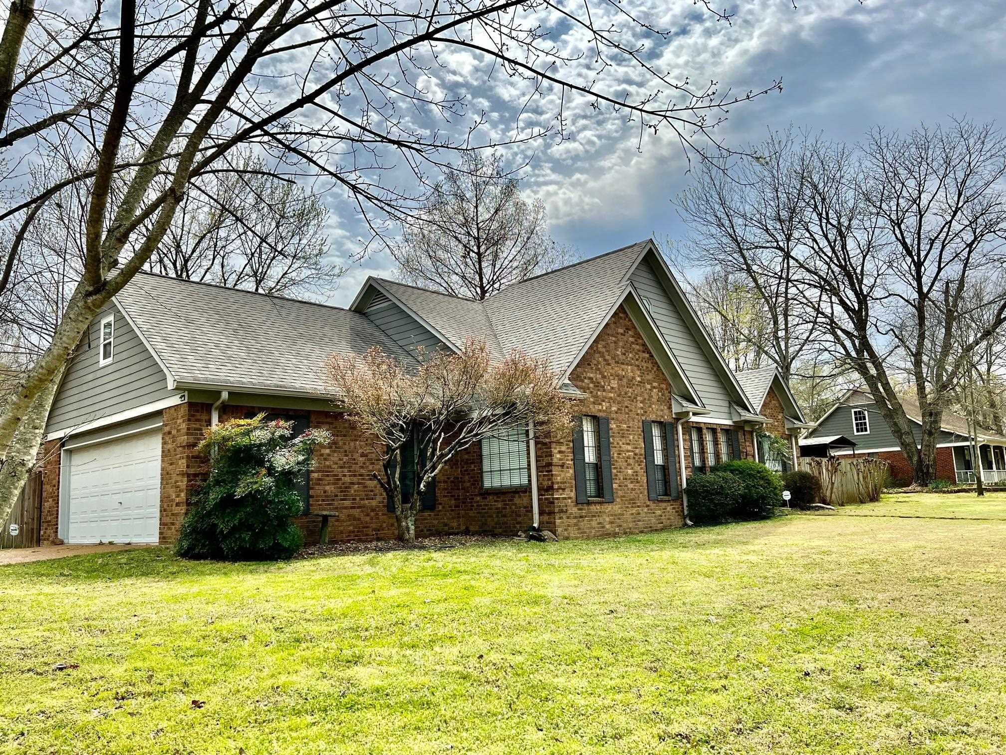 203 Glen Echo Road Collierville, TN 38017 - Photo 3 of 12 a front view of a house with a yard