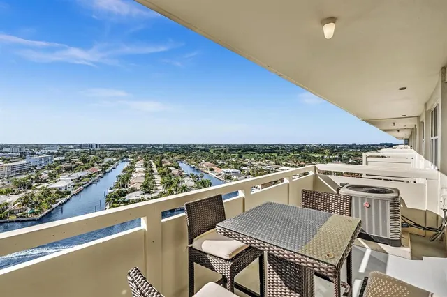a view of a terrace with a table and chairs