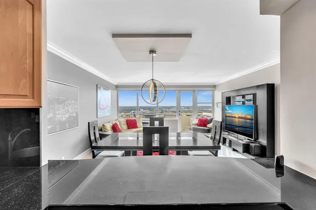 a living room with lots of furniture and a flat screen tv