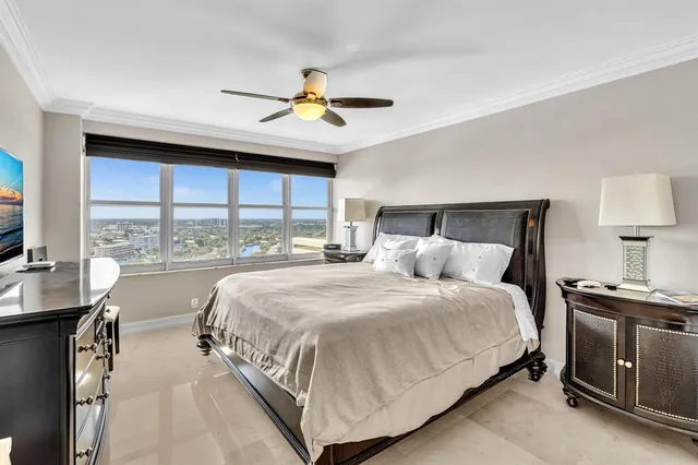 a bedroom with a large bed and a window