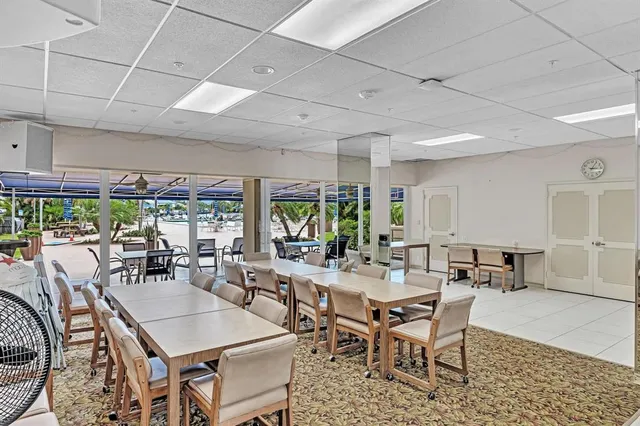a view of a livingroom with furniture and a bookshelf
