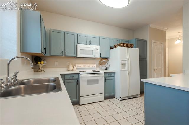 3780 Riviera Grove, Unit 101 Colorado Springs, CO 80922 - Photo 8 of 21 Spacious Kitchen