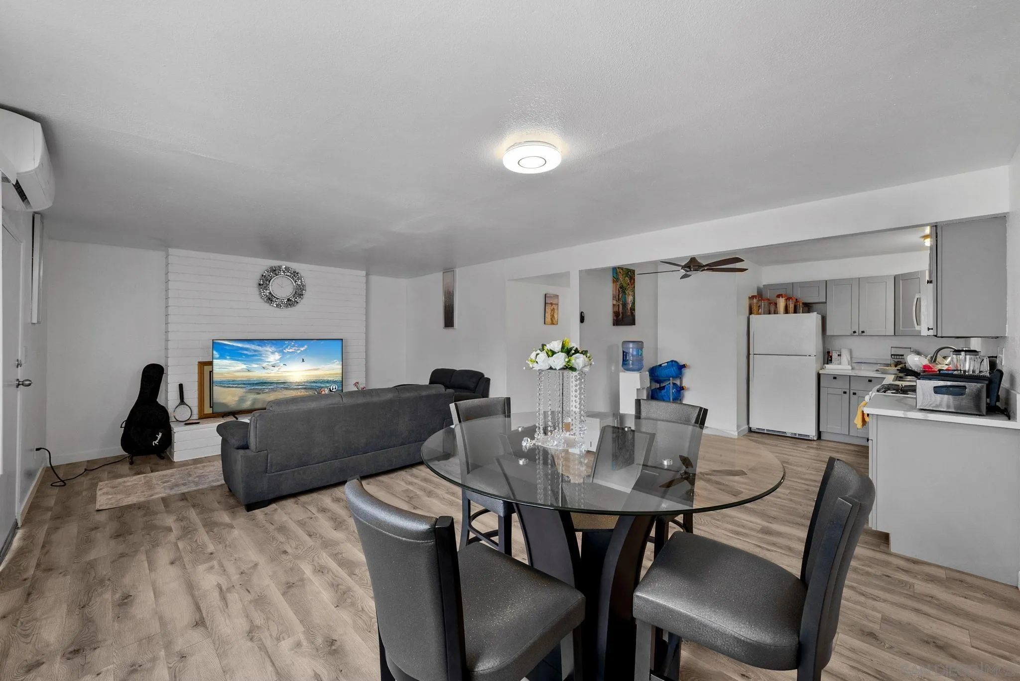 5872-streamview Streamview Drive San Diego, CA 92105 - Photo 2 of 11 a kitchen with sink refrigerator dining table and chairs
