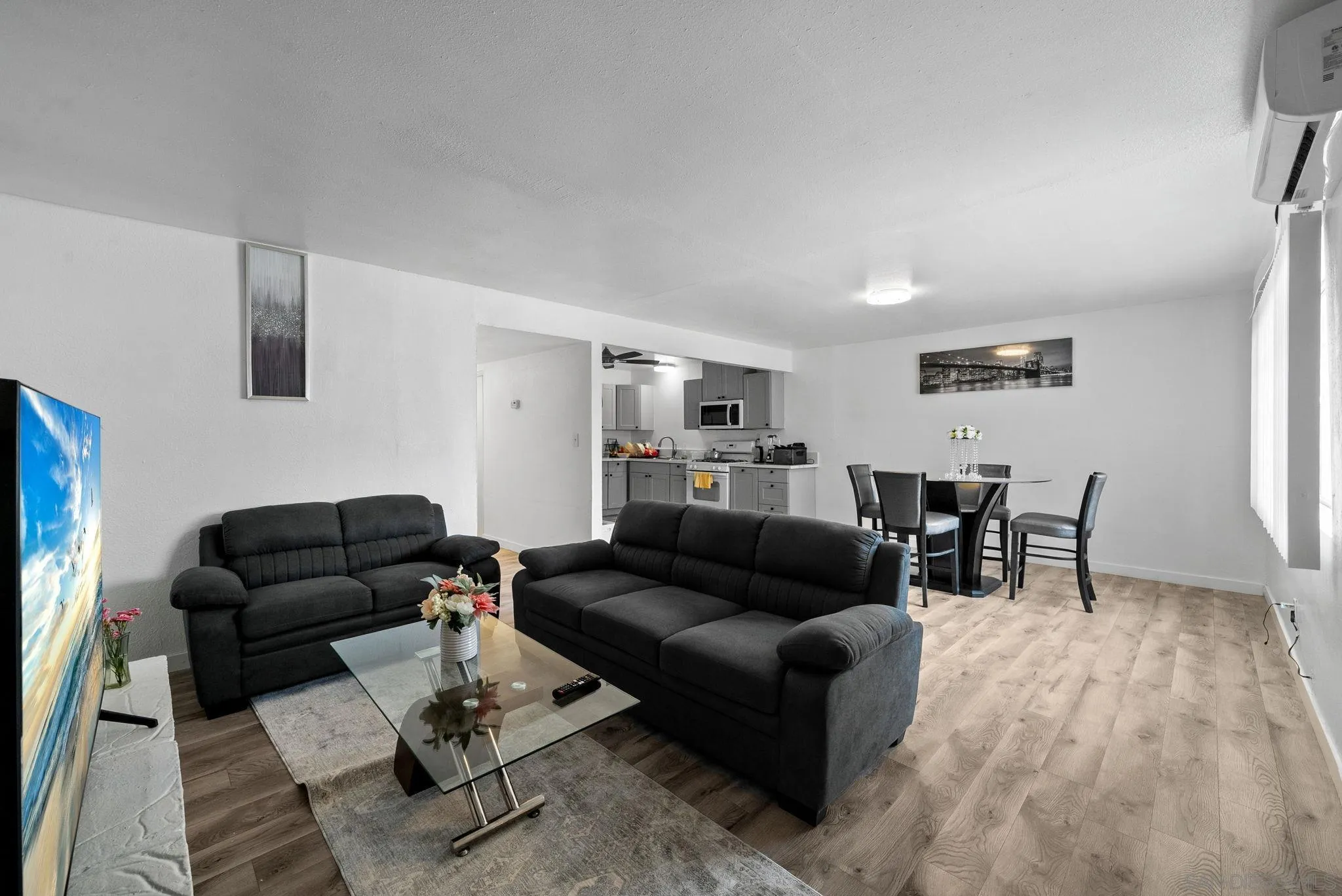 5872-streamview Streamview Drive San Diego, CA 92105 - Photo 3 of 11 a living room with furniture and wooden floor