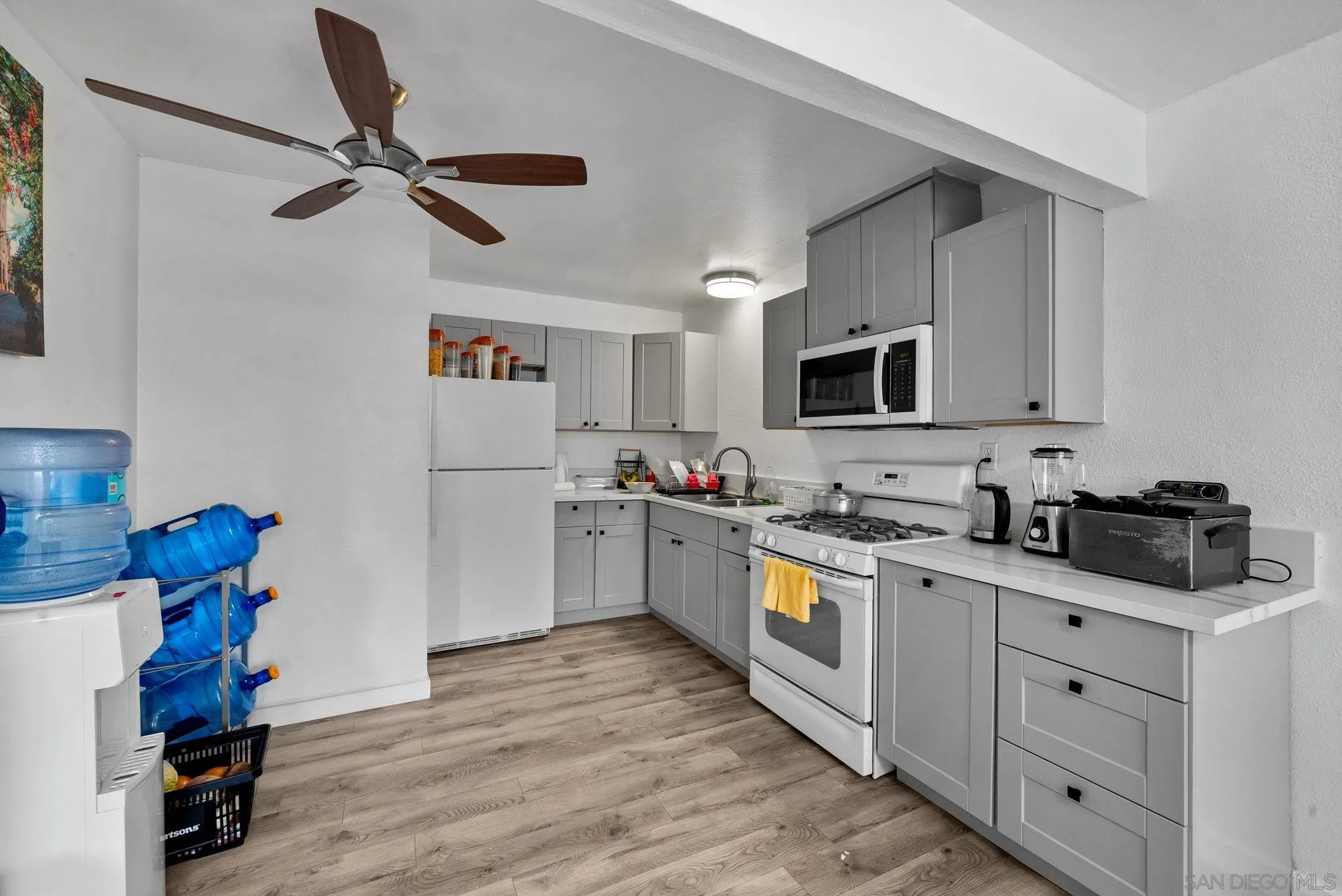 5872-streamview Streamview Drive San Diego, CA 92105 - Photo 4 of 11 a kitchen with a sink cabinets and wooden floor