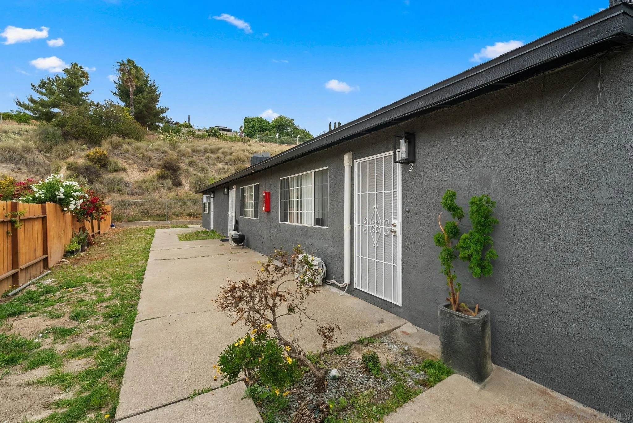 5872-streamview Streamview Drive San Diego, CA 92105 - Photo 10 of 11 a front view of a house with a yard