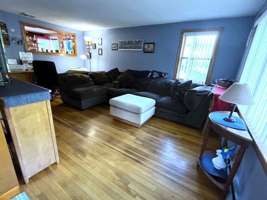 31 Fairchild Avenue Saugus, MA 01906 - Photo 11 of 24 a living room with furniture and a flat screen tv
