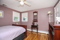 31 Fairchild Avenue Saugus, MA 01906 - Photo 12 of 24 a bedroom with a bed and a table in it