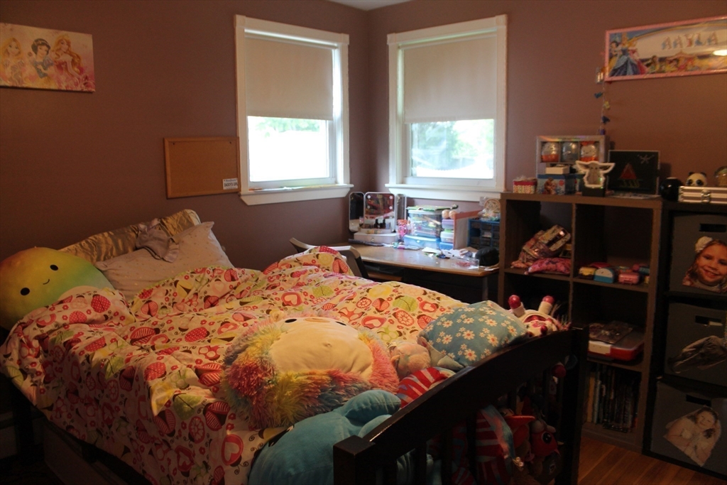 31 Fairchild Avenue Saugus, MA 01906 - Photo 13 of 24 a bed sitting in a bedroom next to a window