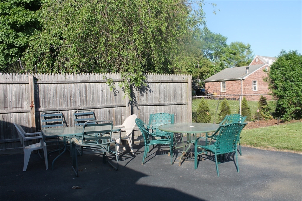 31 Fairchild Avenue Saugus, MA 01906 - Photo 20 of 24 a view of a chairs and table in patio next to a yard
