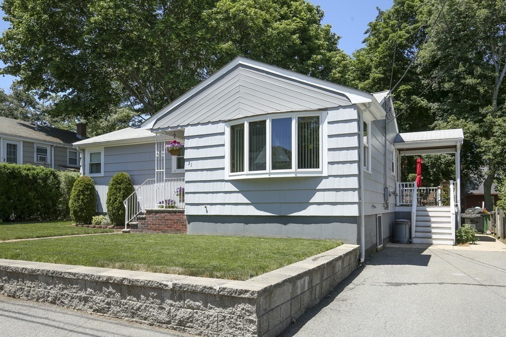 31 Fairchild Avenue Saugus, MA 01906 - Photo 2 of 24 a front view of a house with a yard