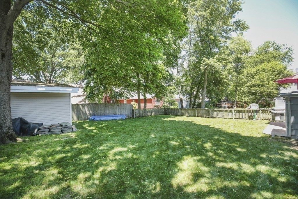 31 Fairchild Avenue Saugus, MA 01906 - Photo 22 of 24 a view of a backyard with a garden and trees