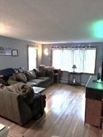 31 Fairchild Avenue Saugus, MA 01906 - Photo 9 of 24 a living room with furniture and a flat screen tv