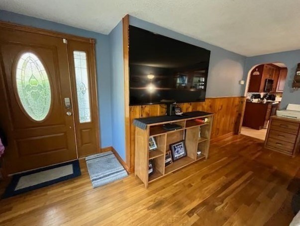 31 Fairchild Avenue Saugus, MA 01906 - Photo 10 of 24 a living room with furniture a flat screen tv and gym equipment