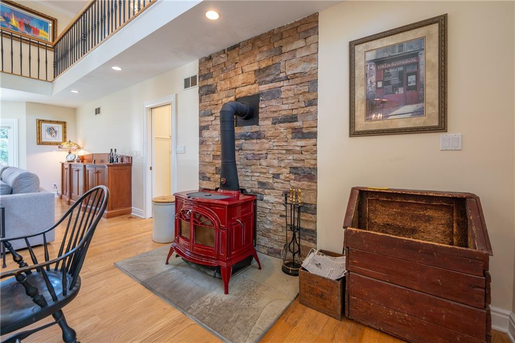 16 McDowell Road Ligonier Township, PA 15658 - Photo 10 of 50 Wood burner accented with a stone wall, great for those chilly winter nights.