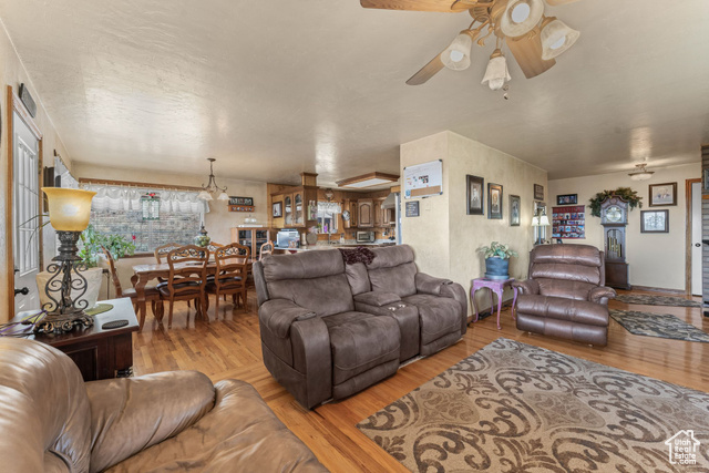 6407 North Dry Frk Cyn Road West Vernal, UT 84078 - Photo 19 of 48 Living room with ceiling fan and wood finished floors