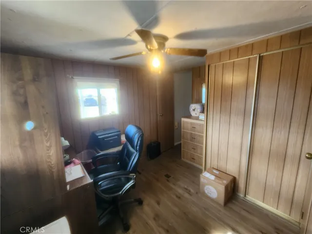 a view of a livingroom with furniture and windows