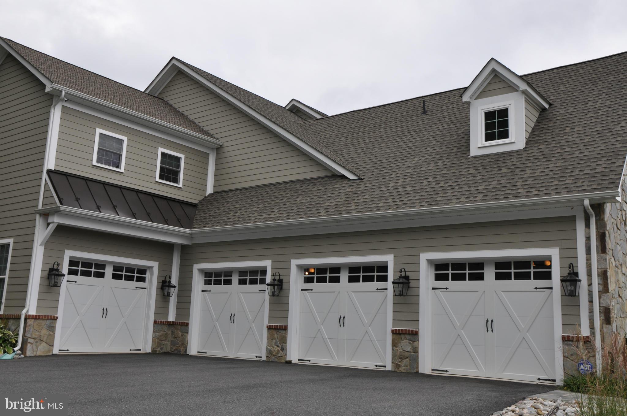 13905 Foxland Road Phoenix, MD 21131 - Photo 3 of 30 a front view of a house with a garage