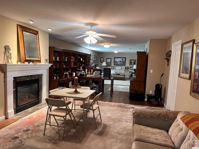 a view of a livingroom with furniture and a fireplace