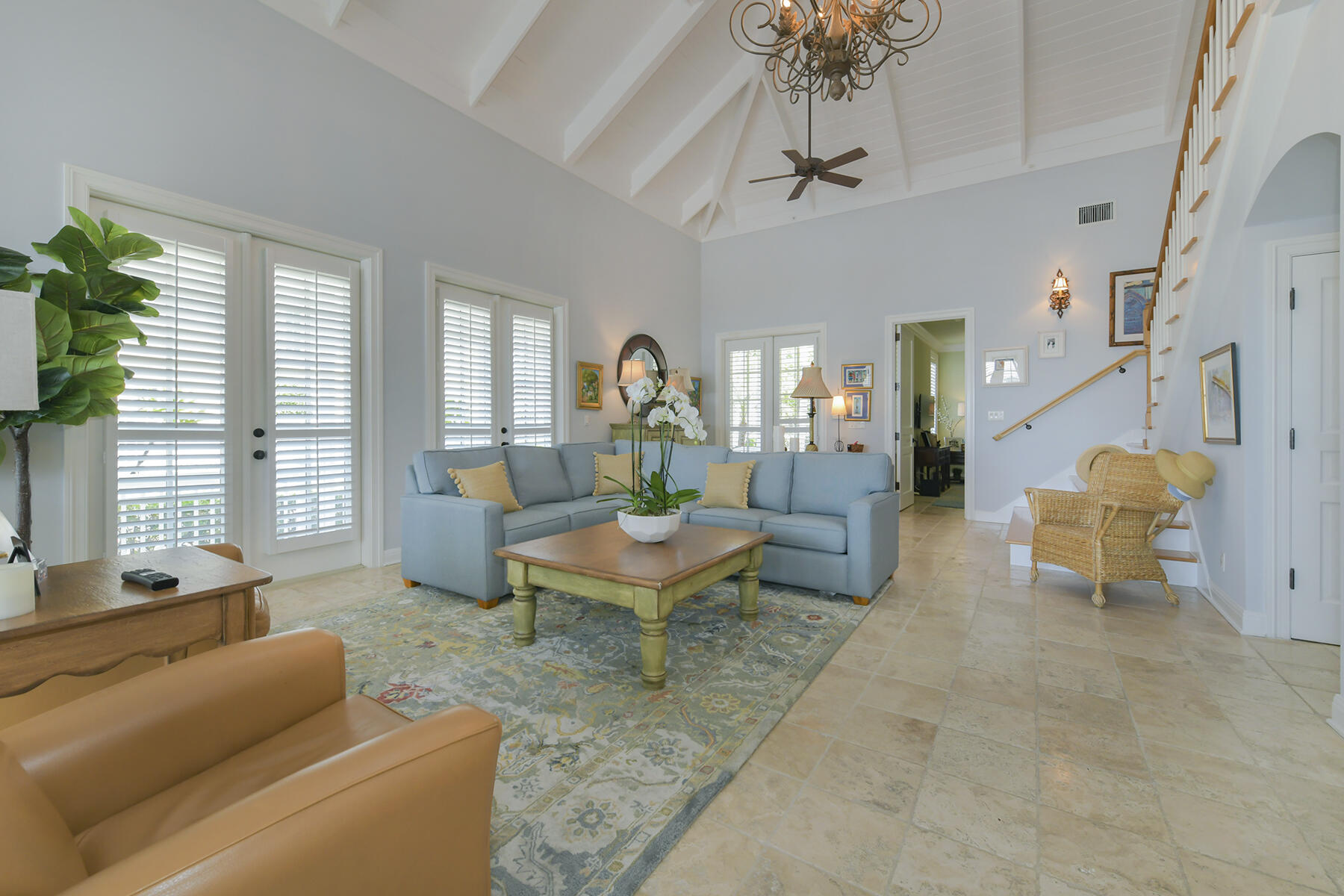 25 Sunset Key Drive Key West, FL 33040 - Photo 8 of 33 a living room with furniture a chandelier and a table