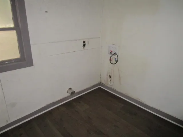 a view of small space with empty racks on the wall