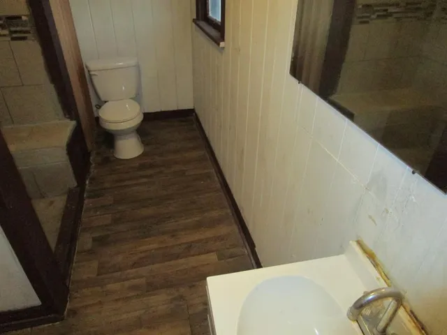 a bathroom with a sink and toilet