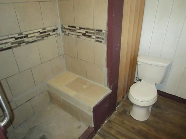 a bathroom with a toilet and a sink