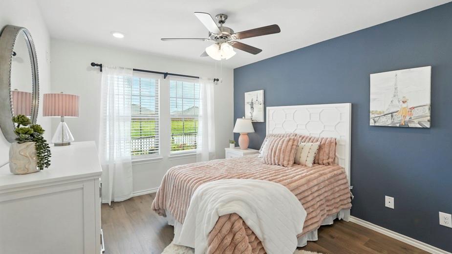 1911 Reveille Way Terrell, TX 75160 - Photo 11 of 39 Bedroom with dark wood-type flooring and a ceiling fan