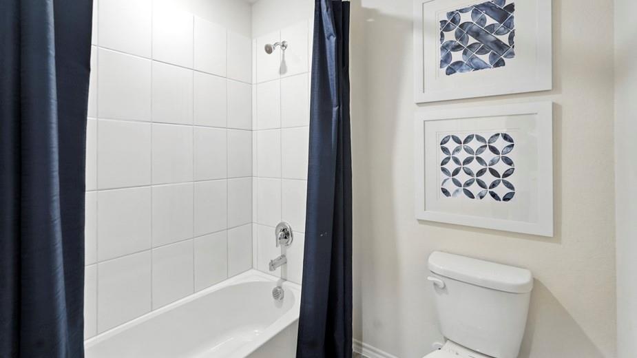 1911 Reveille Way Terrell, TX 75160 - Photo 2 of 39 Bathroom with shower / bathtub combination with curtain and toilet