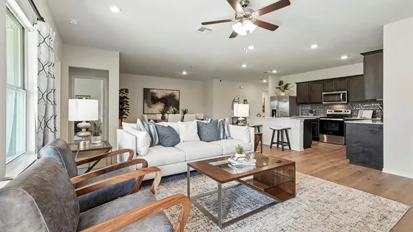 a living room with furniture and a large window
