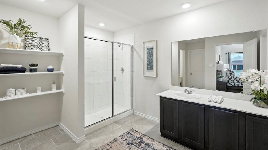 1911 Reveille Way Terrell, TX 75160 - Photo 22 of 39 Ensuite bathroom with a stall shower and vanity