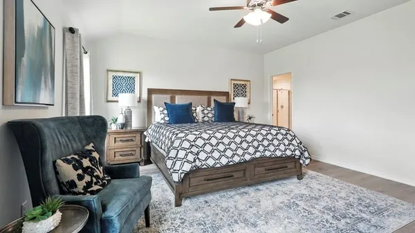 a spacious bathroom with a double vanity sink a large mirror and shower