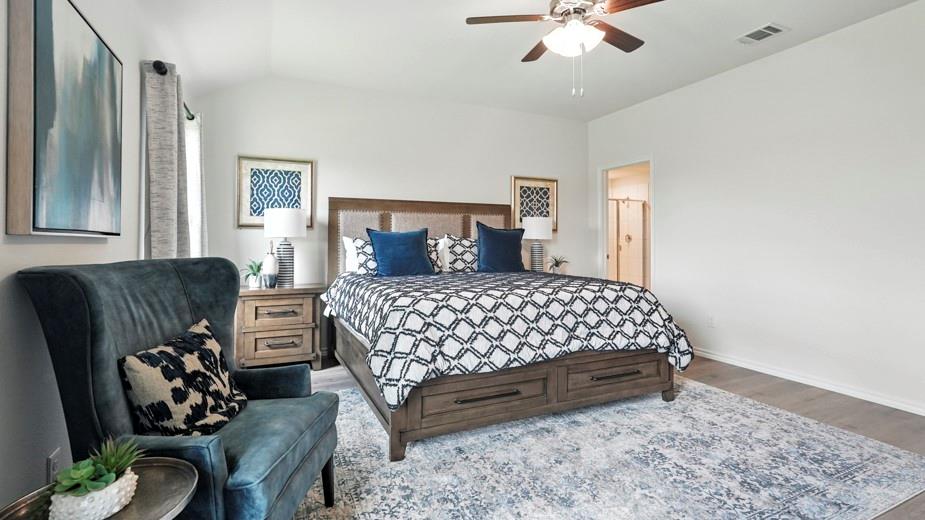 1911 Reveille Way Terrell, TX 75160 - Photo 23 of 39 Bedroom with wood finished floors, ceiling fan, and vaulted ceiling