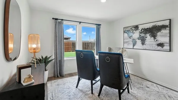 a view of a dining room with furniture window and outside view